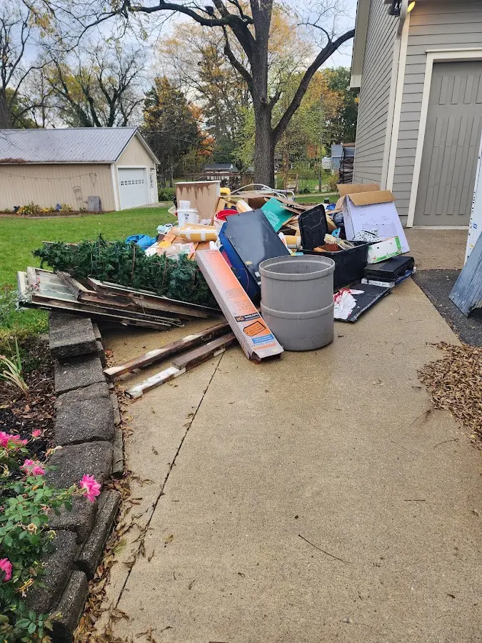 Dumpster being loaded with debris for 3 Yard Dumpster Rental in New Brunswick